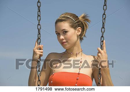 Woman on a swing View Large Photo Image Stock Photo - Woman on a swing. Fotosearch