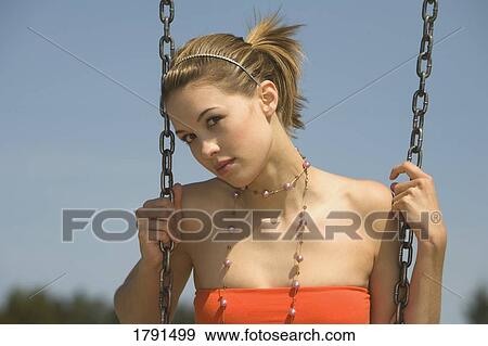 Woman on a swing View Large Photo Image Stock Photo - Woman on a swing. Fotosearch