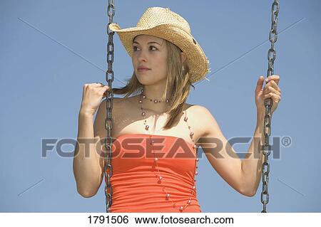 Woman on a swing View Large Photo Image Stock Photograph - Woman on a swing. Fotosearch