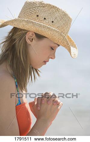 Woman praying at beach View Large Photo Image Stock Image - Woman praying at beach. Fotosearch