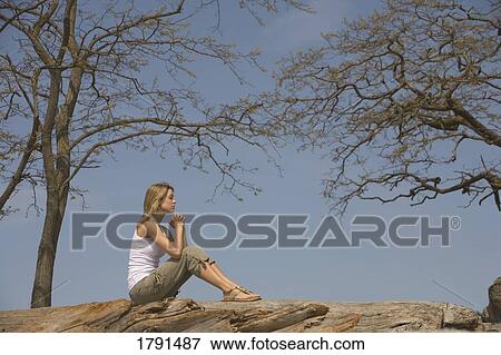Woman praying outdoors View Large Photo Image Stock Photo - Woman praying outdoors. Fotosearch