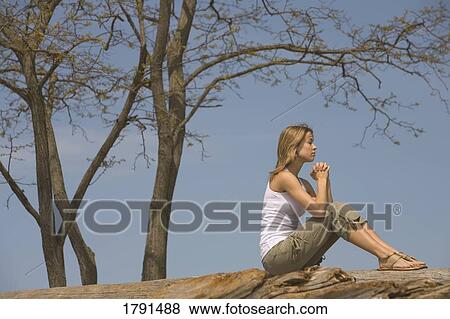 Woman praying outdoors View Large Photo Image Stock Photo - Woman praying outdoors. Fotosearch