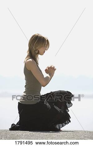 Woman praying View Large Photo Image Stock Photography - Woman praying. Fotosearch