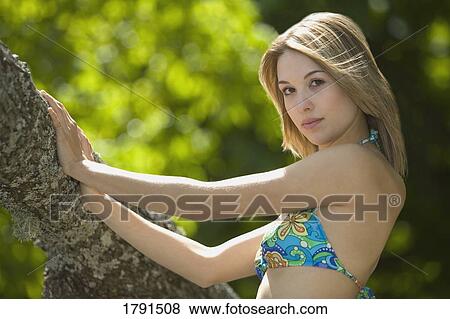 Woman wearing a bikini View Large Photo Image Stock Photo - Woman wearing a bikini. Fotosearch