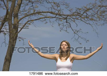 Stock Photograph - Woman worshipping. Fotosearch
