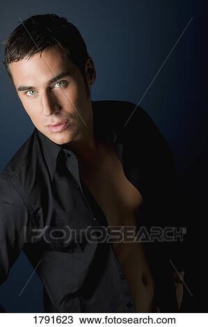 Young adult man posing View Large Photo Image Stock Image - Young adult man posing. Fotosearch