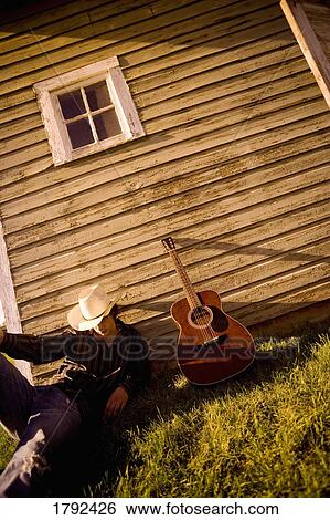 Young cowboy with guitar View Large Photo Image Stock Photograph - Young cowboy with guitar. Fotosearch