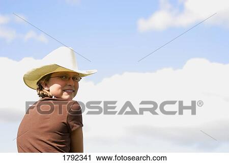 Stock Image - Young cowgirl. Fotosearch