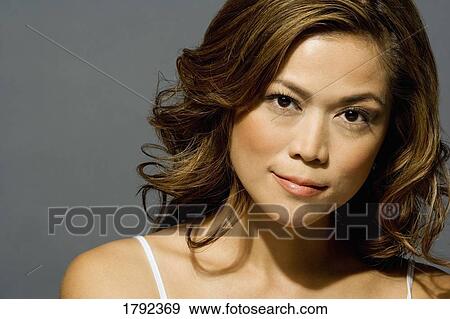 Young woman posing View Large Photo Image Stock Photo - Young woman posing. Fotosearch