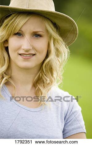 Young woman with hat View Large Photo Image Stock Image - Young woman with hat. Fotosearch