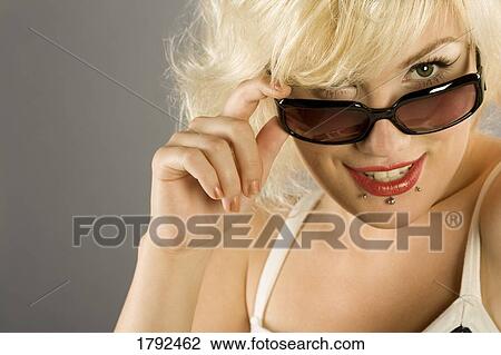 Young woman with sunglasses View Large Photo Image Stock Image - Young woman with sunglasses. Fotosearch