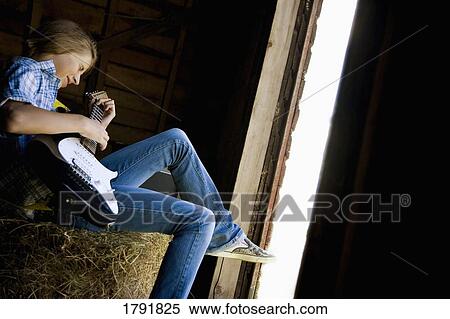 Youth playing electric guitar View Large Photo Image Stock Photography - Youth playing electric guitar. Fotosearch