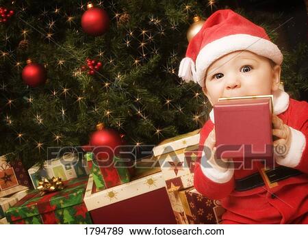 Baby dressed as Santa View Large Photo Image Stock Photo - Baby dressed as Santa. Fotosearch