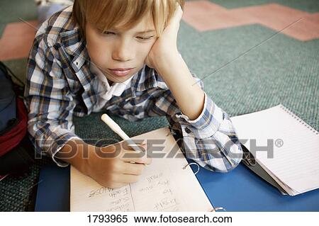 Boy doing homework View Large Photo Image Stock Photography - Boy doing homework. Fotosearch