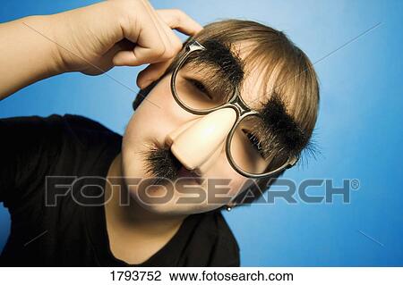 Boy in groucho glasses View Large Photo Image Stock Image - Boy in groucho glasses. Fotosearch