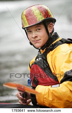 Stock Image - Boy kayaking. Fotosearch
