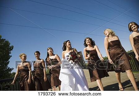 Stock Photograph - Bride and bridesmaids. Fotosearch