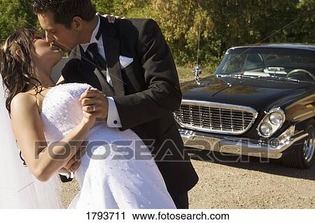 Bride and Groom kissing View Large Photo Image Stock Image - Bride and Groom kissing. Fotosearch