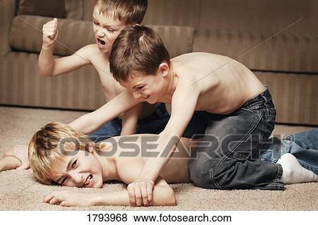 Brothers fighting View Large Photo Image Stock Photo - Brothers fighting. Fotosearch