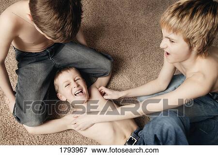 Brothers playing View Large Photo Image Stock Photo - Brothers playing. Fotosearch