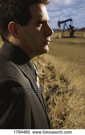 Business man in oil field View Large Photo Image Stock Photography - Business man in oil field. Fotosearch