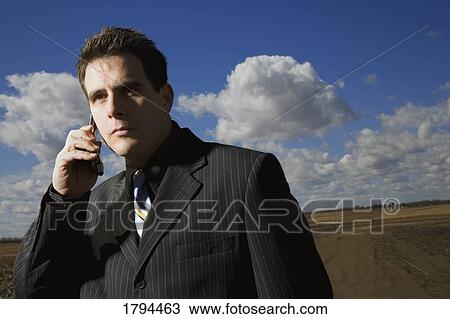 Businessman on cell phone View Large Photo Image Stock Image - Businessman on cell phone. Fotosearch
