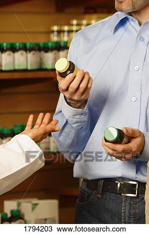 Choosing between vitamins View Large Photo Image Stock Image - Choosing between vitamins. Fotosearch