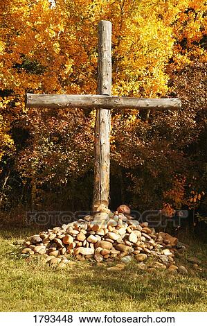 Stock Photo - Cross on pile of rocks. Fotosearch
