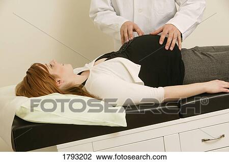 Doctor examining pregnant woman View Large Photo Image Stock Image - Doctor examining pregnant woman. Fotosearch
