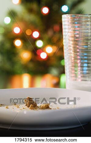 Stock Photography - Eaten cookies and glass of milk. Fotosearch