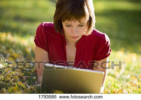 Stock Photography - Female working on a laptop. Fotosearch