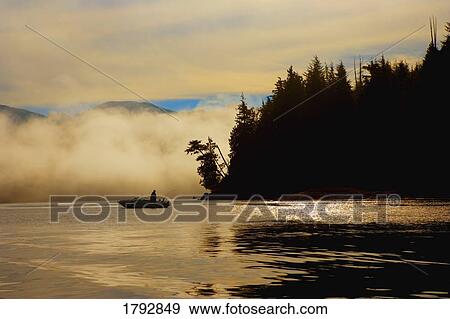 Fisherman in boat View Large Photo Image Stock Photo - Fisherman in boat. Fotosearch