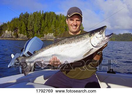 Stock Photo - Fisherman with fish. Fotosearch