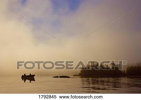 Stock Photography - Fishermen by island. Fotosearch