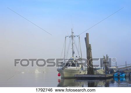 Fishing boat at a dock View Large Photo Image Stock Photograph - Fishing boat at a dock. Fotosearch