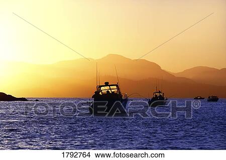Picture - Fishing boats at sunrise. Fotosearch