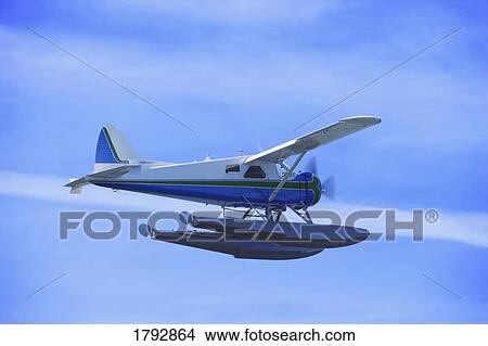 Float plane in flight View Large Photo Image Picture - Float plane in flight. Fotosearch