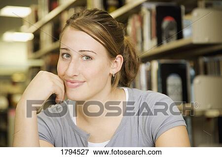 Girl in library View Large Photo Image Stock Photo - Girl in library. Fotosearch