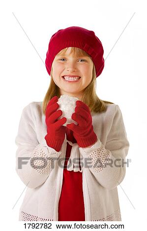 Girl in red had and mitts holding snowball View Large Photo Image Stock Image - Girl in red had and mitts holding snowball. Fotosearch