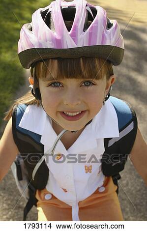 Picture - Girl riding her bike. Fotosearch