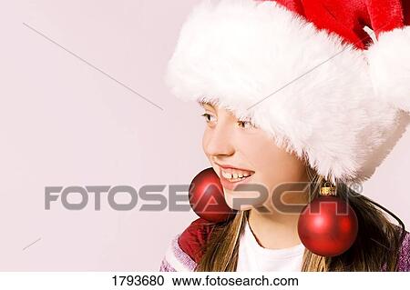 Stock Image - Girl with Christmas outfit. Fotosearch