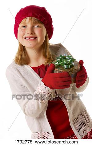 Girl with Christmas present View Large Photo Image Stock Photo - Girl with Christmas present. Fotosearch