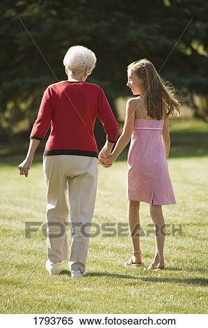 Grandmother and granddaughter holding hands View Large Photo Image Stock Photography - Grandmother and granddaughter holding hands. Fotosearch