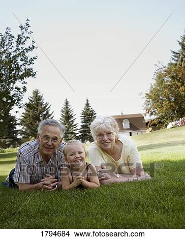 Picture - Grandparents and granddaughter. Fotosearch