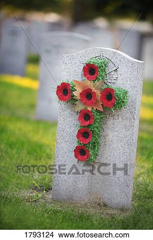 Grave stone with poppy wreath View Large Photo Image Picture - Grave stone with poppy wreath. Fotosearch