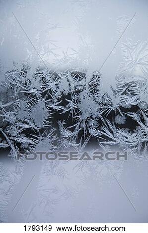 Stock Photo - Ice crystal patterns on glass. Fotosearch