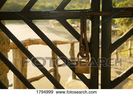 Stock Photo - Lock on an iron gate. Fotosearch