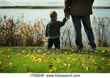 Stock Photo - Man and child. Fotosearch
