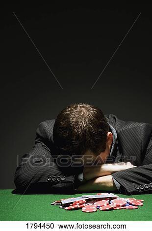 Stock Image - Man gambles it all away. Fotosearch