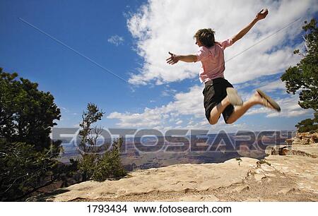 Picture - Man jumping for joy. Fotosearch